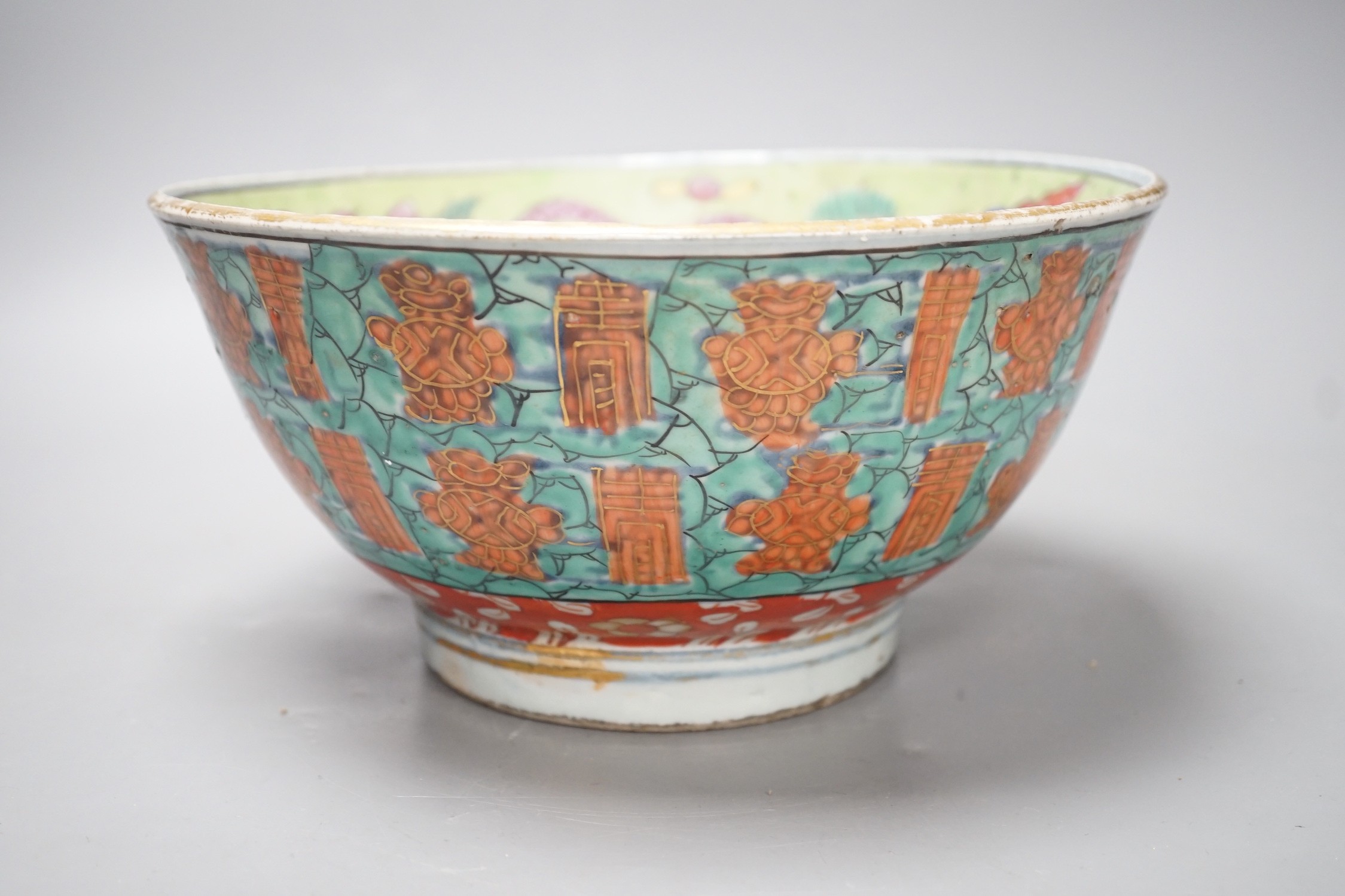 An 18th century clobbered Chinese or Japanese porcelain bowl, 24.5cm diameter